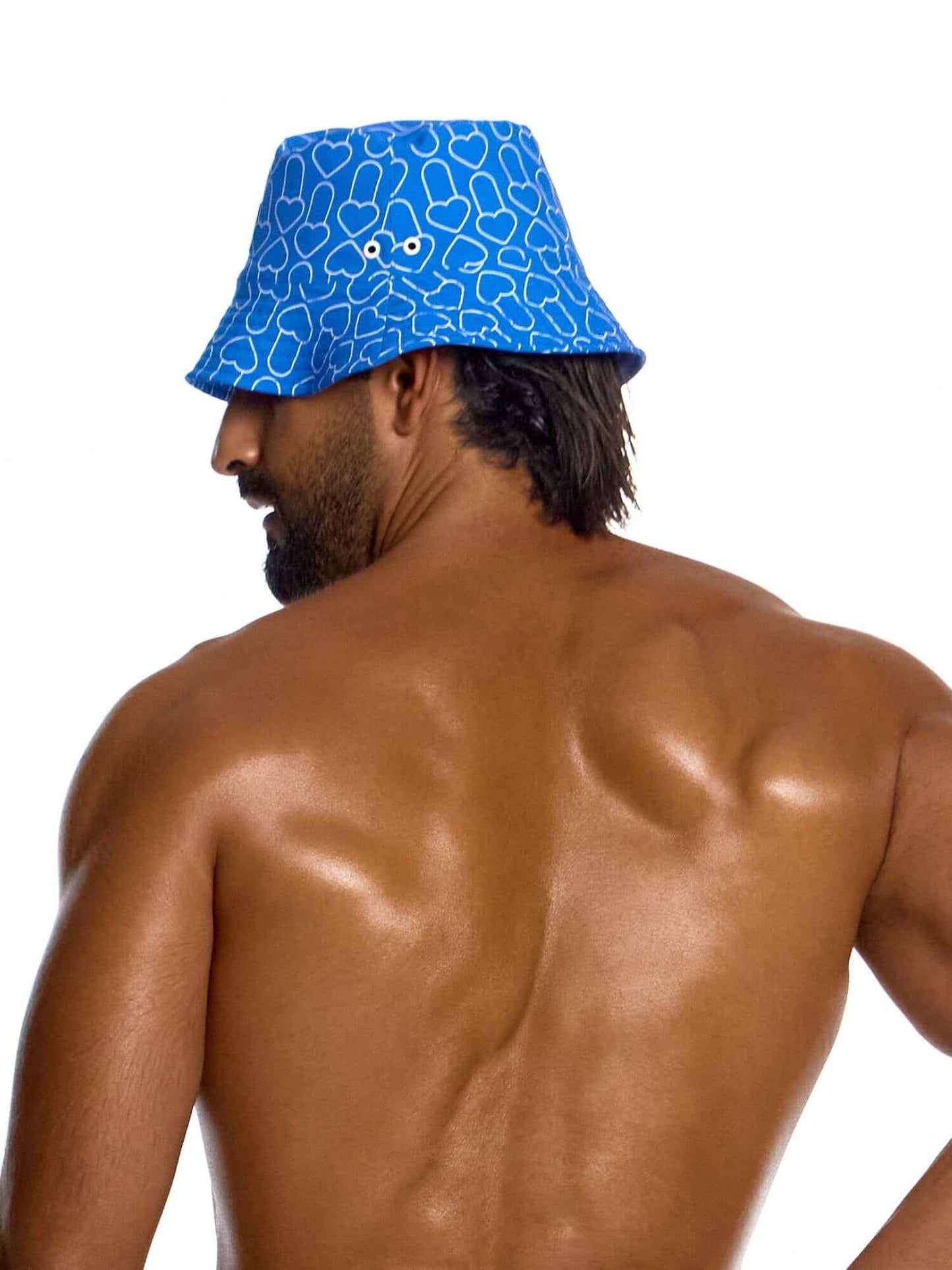 Man wearing a blue bucket hat with a pattern on a white background