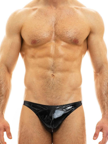 A model wearing a yellow MODUS VIVENDI PVC vinyl mini brief with a low-rise waist and high-cut legs.