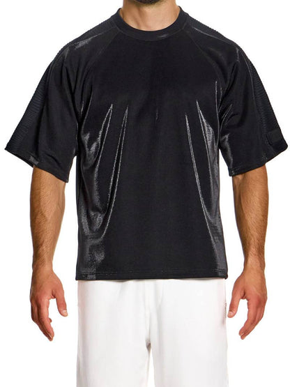 A male model wearing an oversized orange t-shirt with a rounded neck and a rubberized Modus Vivendi label on the back.