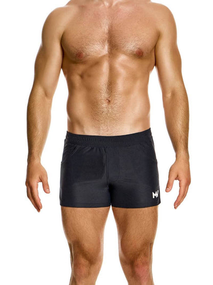A pair of red active shorts with a drawstring waistband, elasticated at the waist, and featuring side slits. The brand's logo is visible on the leg.