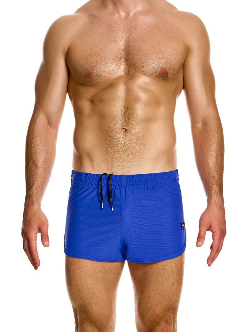 A man wearing blue jogging-style gym shorts with a drawstring waist.