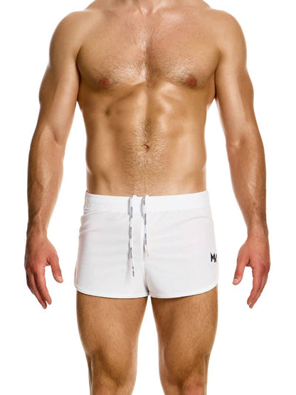 A man wearing blue jogging-style gym shorts with a drawstring waist.