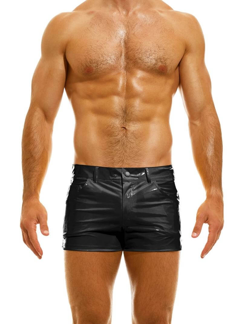 A man wearing red PVC vinyl 5 pocket shorts with a zip-up fly, button fastening, belt loops, and a thermo logo on the back pocket.