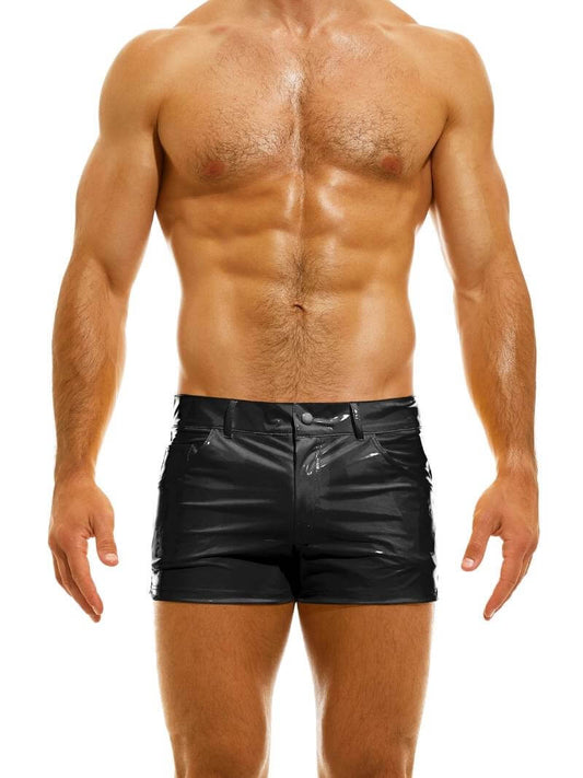 A man wearing red PVC vinyl 5 pocket shorts with a zip-up fly, button fastening, belt loops, and a thermo logo on the back pocket.
