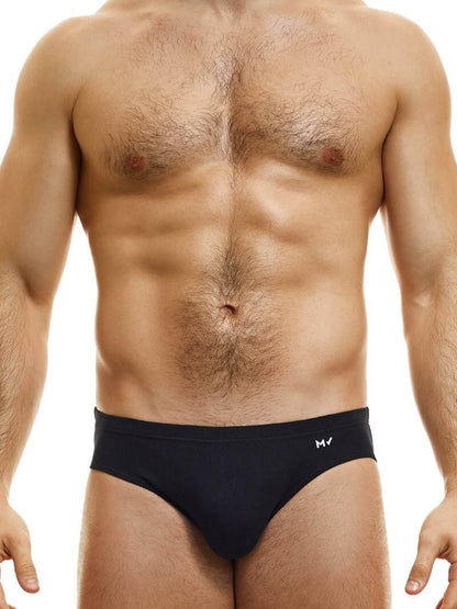 This image displays the MODUS VIVENDI Peace Classic Brief, modeled in a striking neon blue color. The briefs are designed with a low-rise waistband that ensures a modern and comfortable fit.