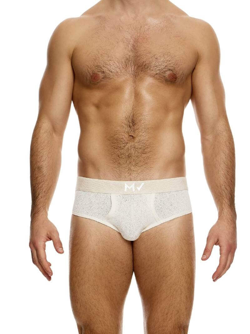 This image features the MODUS VIVENDI Plain Knit Classic Brief in a vibrant pink color. The brief showcases a fine knit texture made from a blend of polyester and cotton, ensuring both comfort and durability.