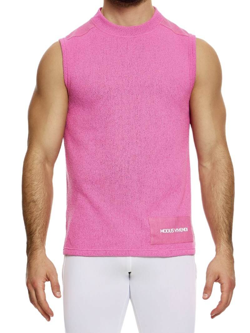 A male model wearing a white plain knit vest with a semi-turtle neck and long length.