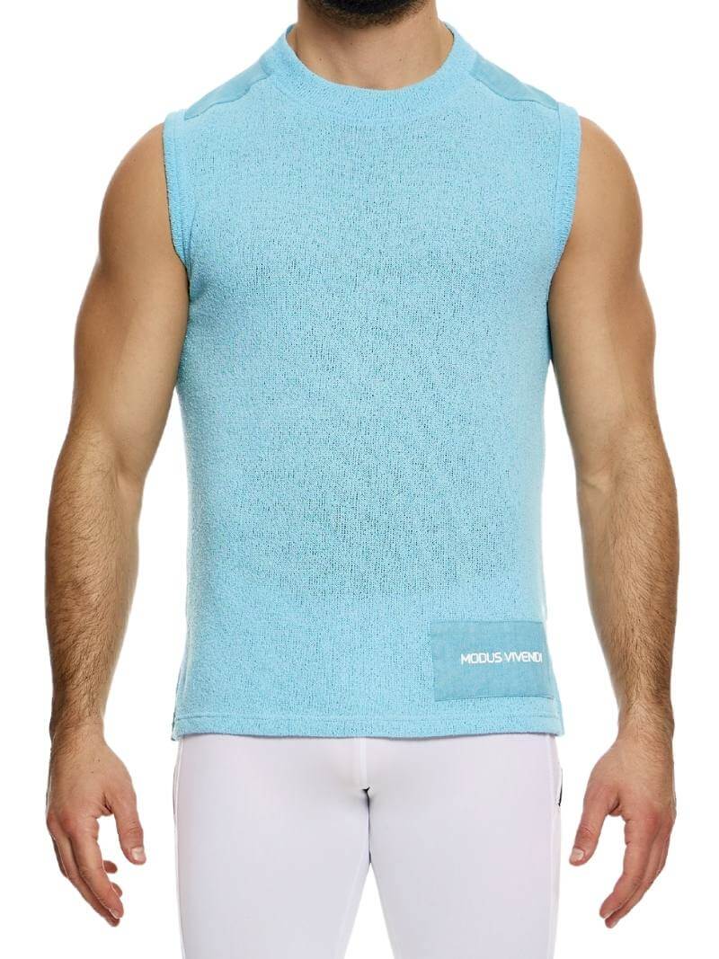 A male model wearing a white plain knit vest with a semi-turtle neck and long length.