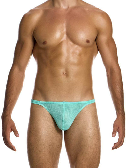 A man wearing a bold pink retro micro net cotton thong by Modus Vivendi.