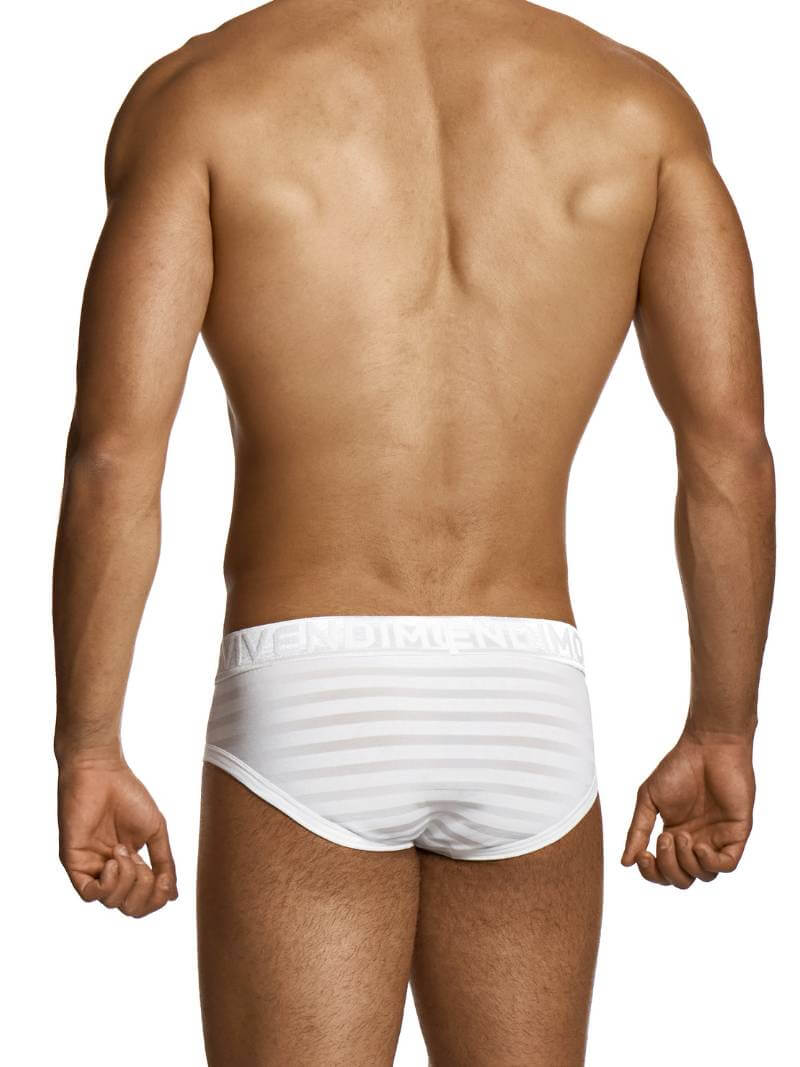 Man wearing a white striped underwear on a plain background