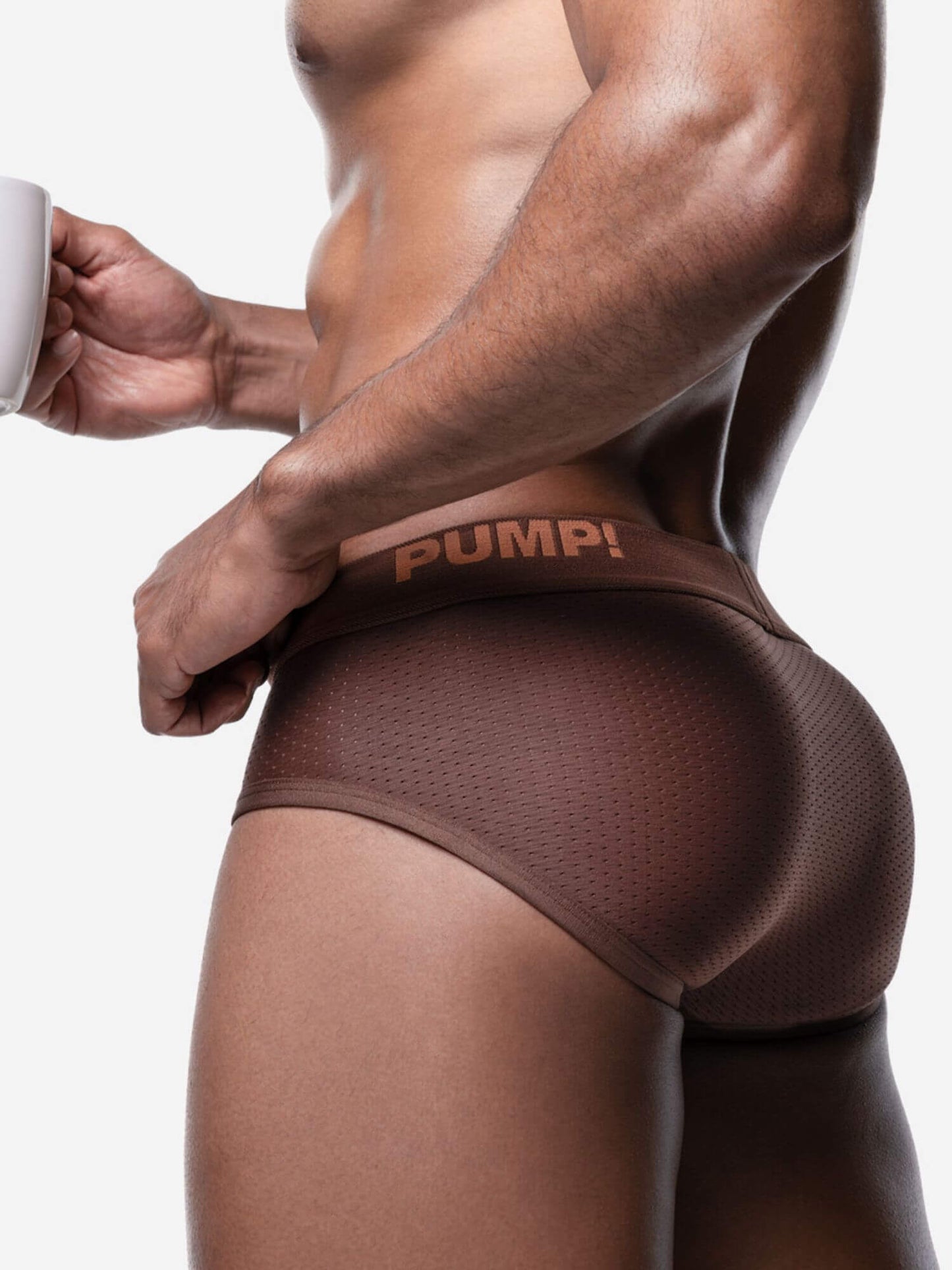 Person wearing brown underwear with 'Pump!' branding on a white background