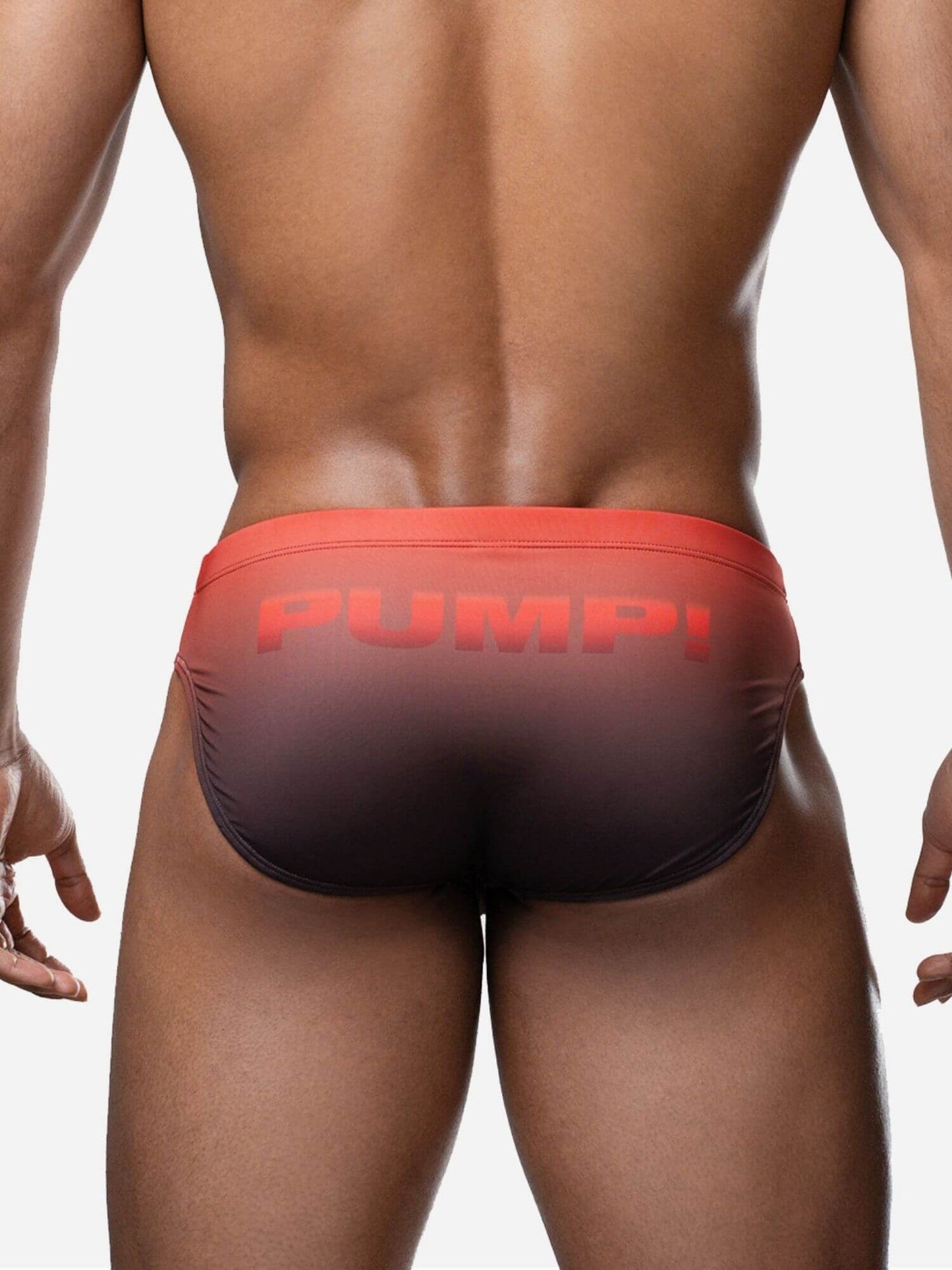 Red swim brief with 'PUMP!' text on a plain background