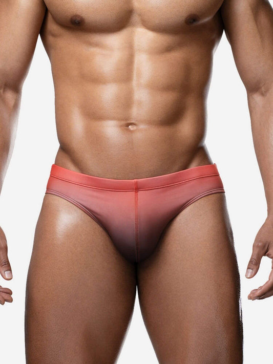 Man wearing a red swim suit on a white background