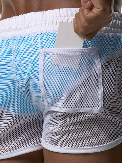 White mesh shorts with a pocket holding a white card.