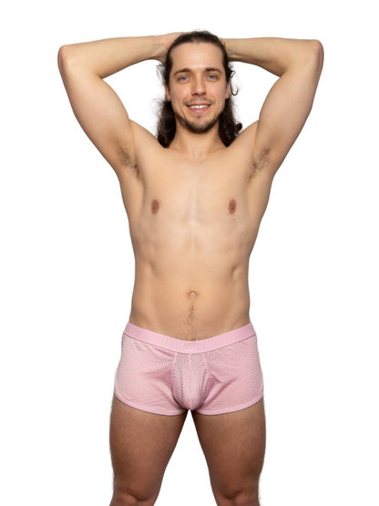Man wearing pink underwear on a white background