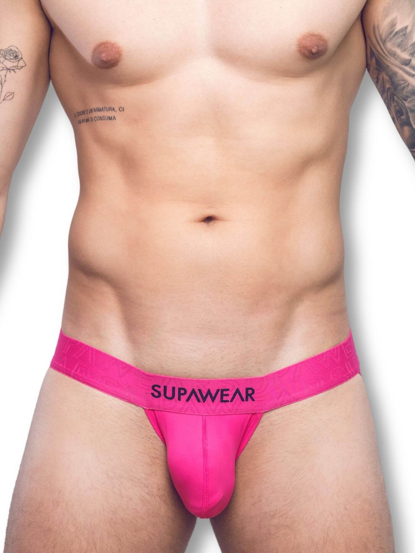Person wearing a bright pink thong with 'Supawear' branding on a white background