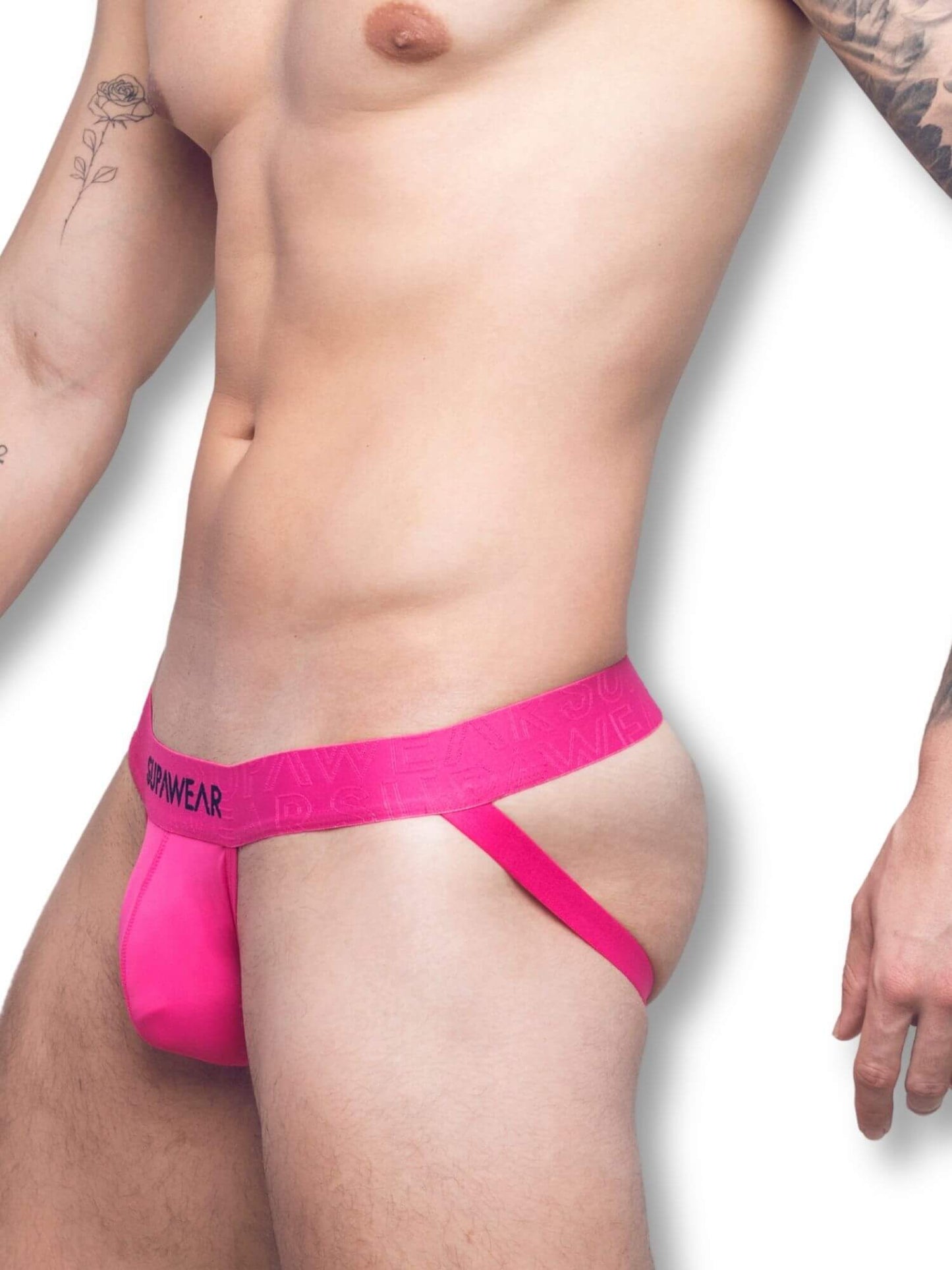 Person wearing a bright pink jockstrap on a white background