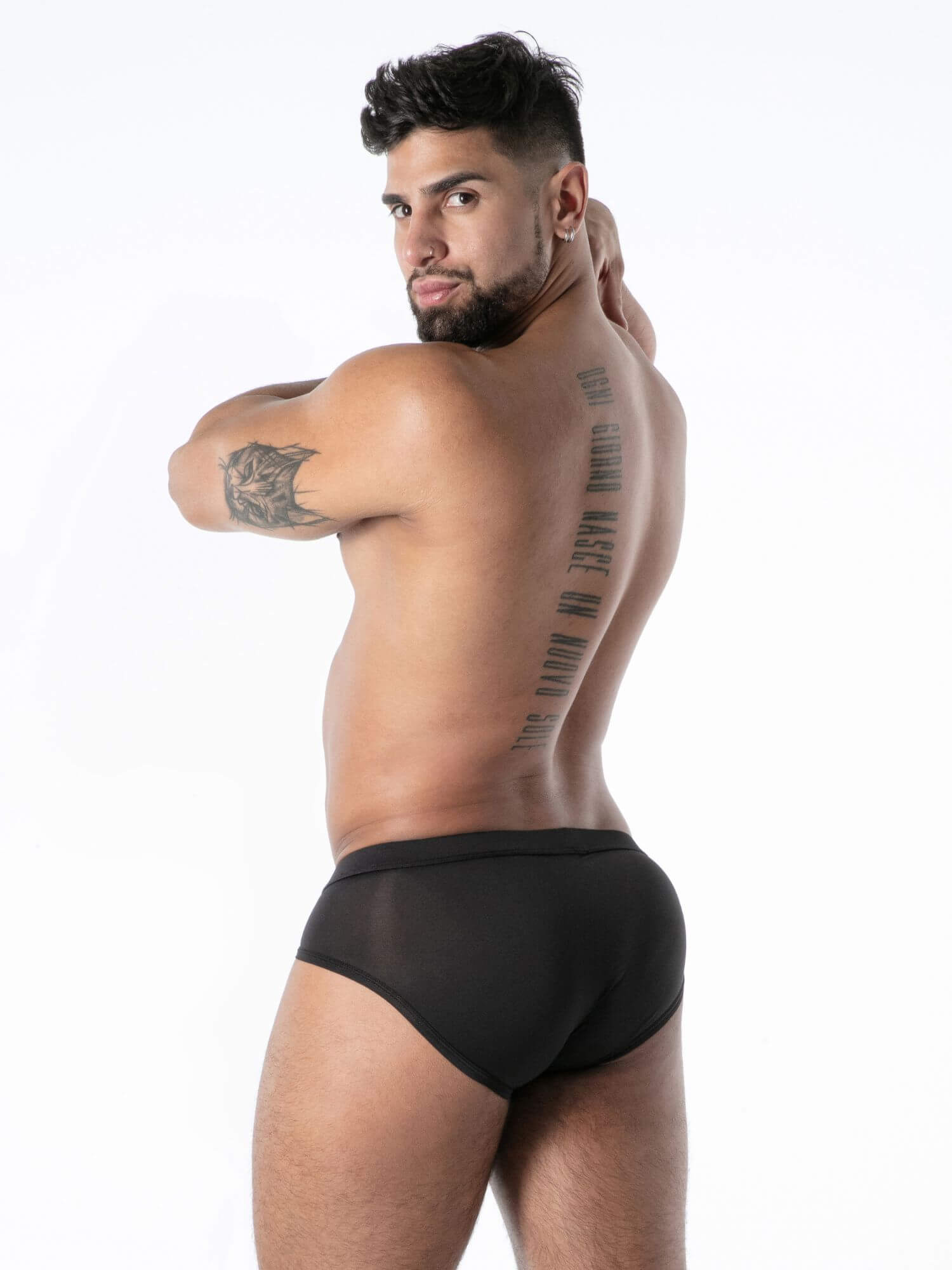 Man wearing black underwear with a white background