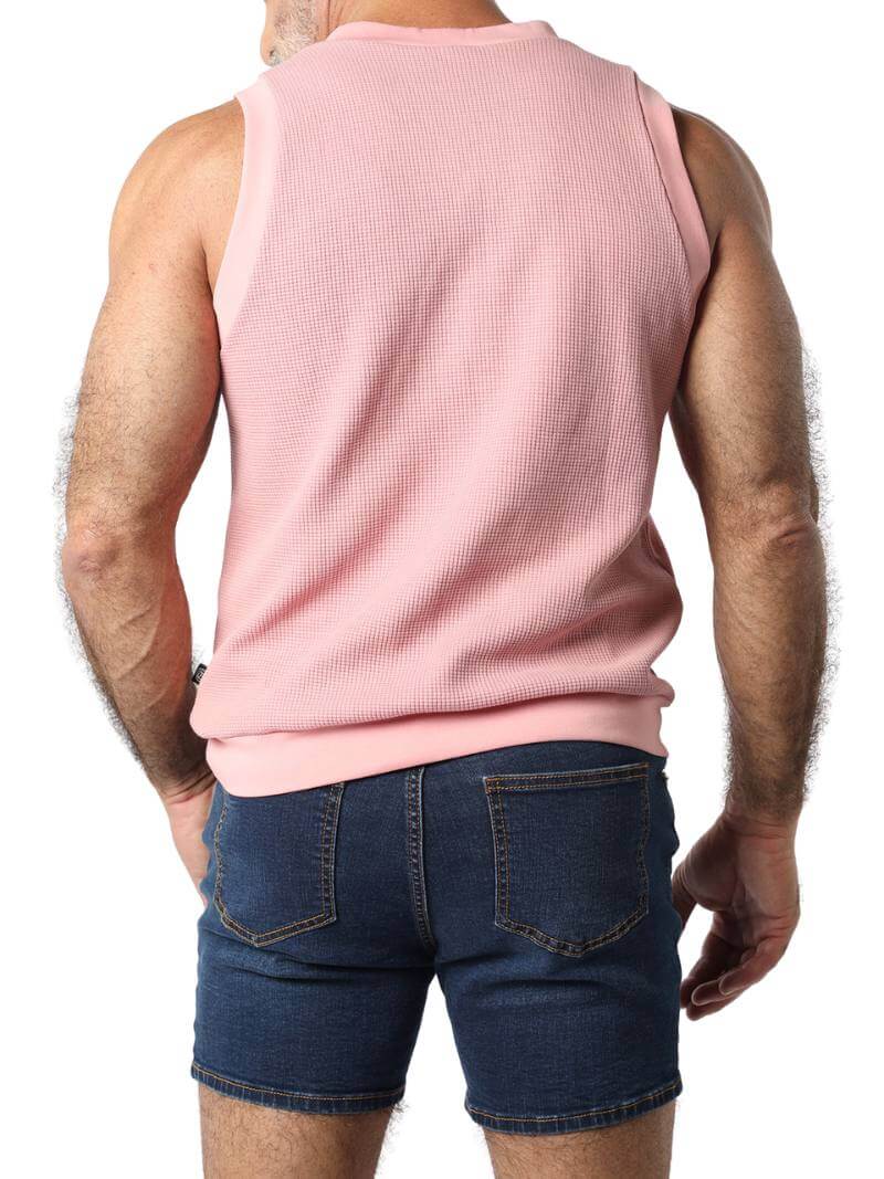 Close-up of a pink checkered garment with a focus on texture and pattern.