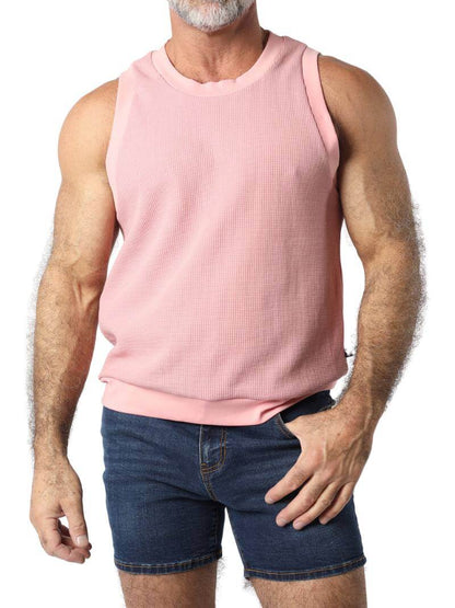 A male model wearing a black sleeveless knitted tank top with a round neck, branded with Timoteo on the side.