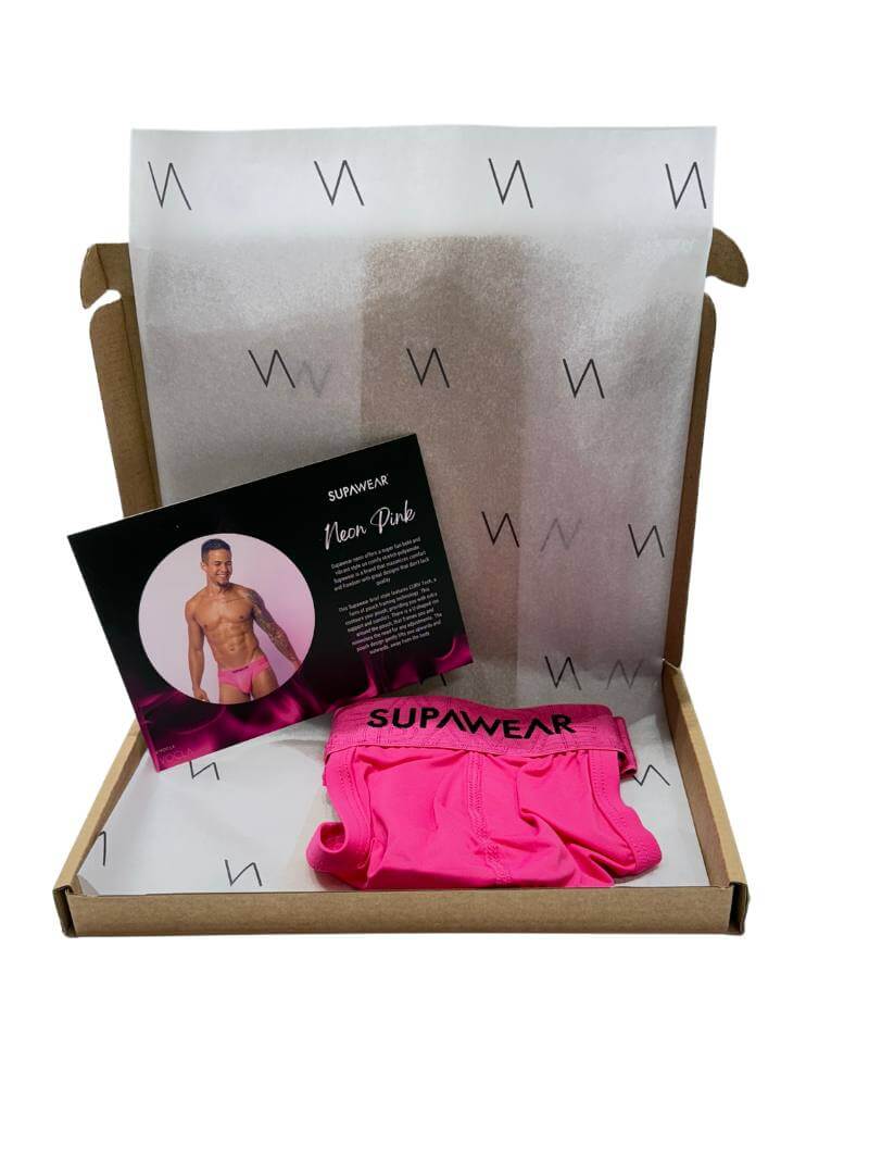 Pink underwear with packaging and branding details on a white background