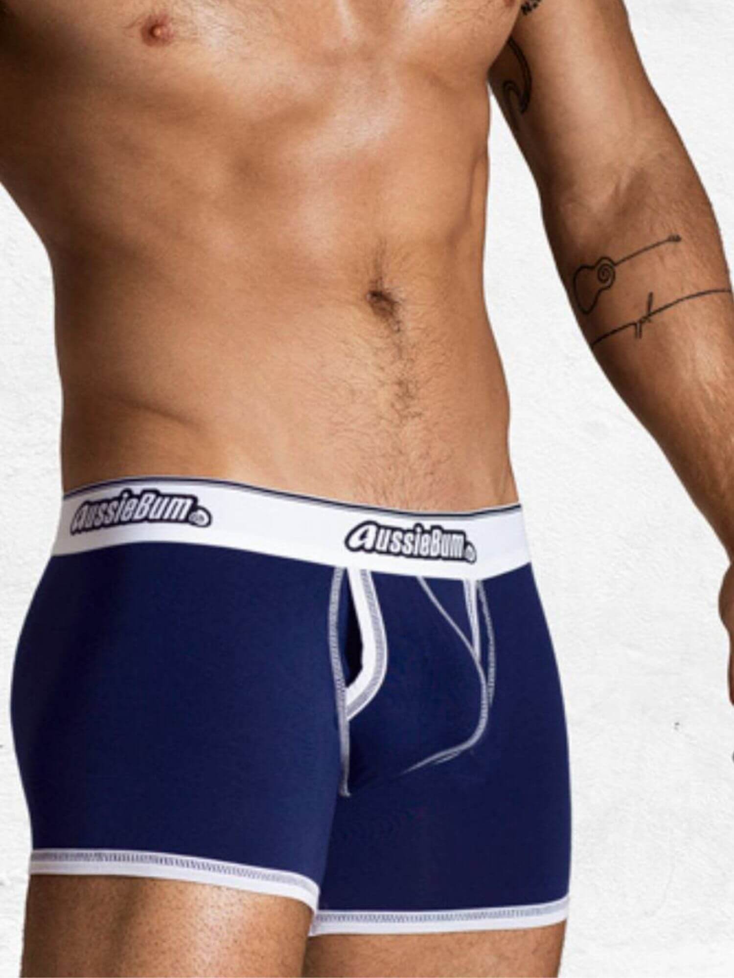 Navy blue underwear with white waistband featuring 'AussieBum' brand on a plain background.