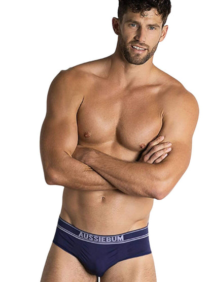 Man wearing navy blue underwear with 'AUSSIEBUM' branding on a white background