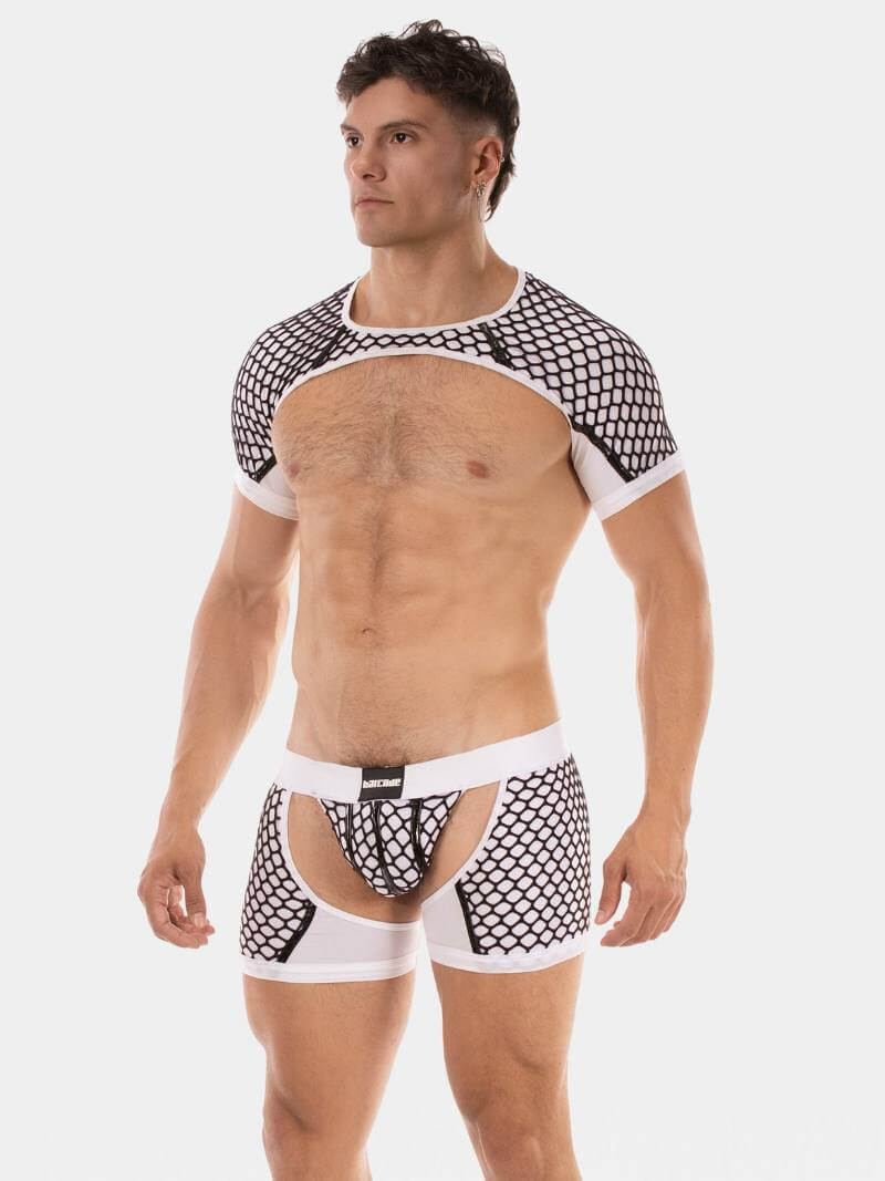 Man wearing a black and white patterned shirt and underwear set on a white background