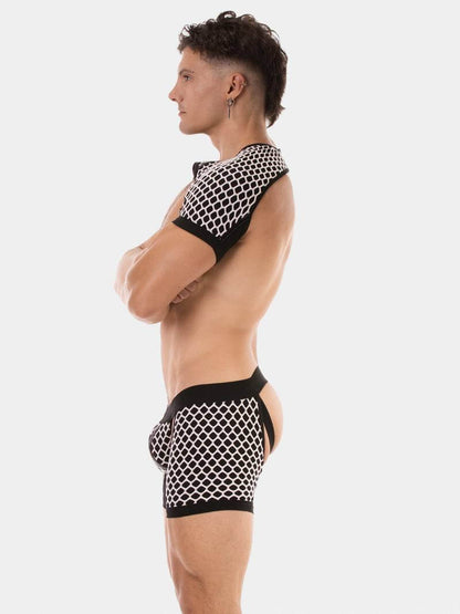 Person wearing a black and white mesh outfit on a plain background
