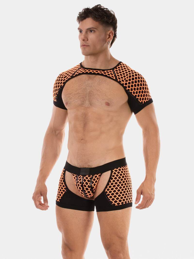 Man wearing a black and orange patterned athletic outfit on a white background