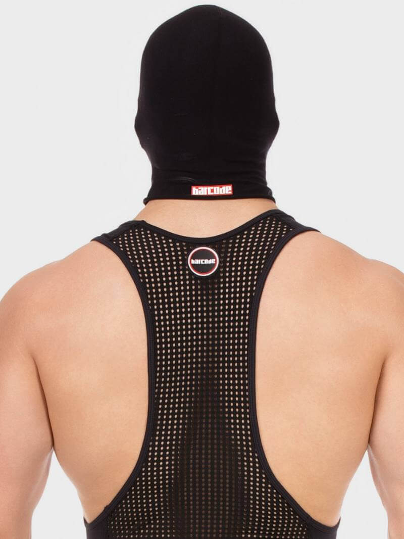 Person wearing a black mesh tank top with brand logos on a white background