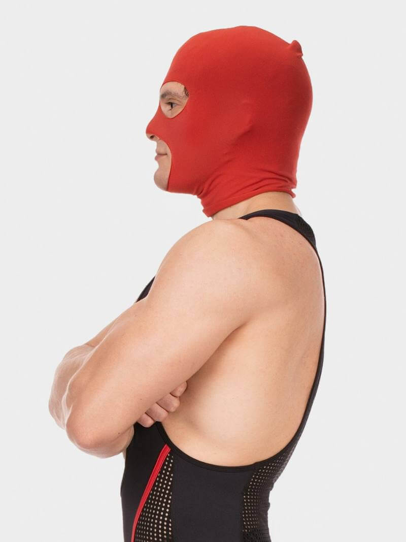 Person wearing a red hood and black swimsuit with red accents on a white background