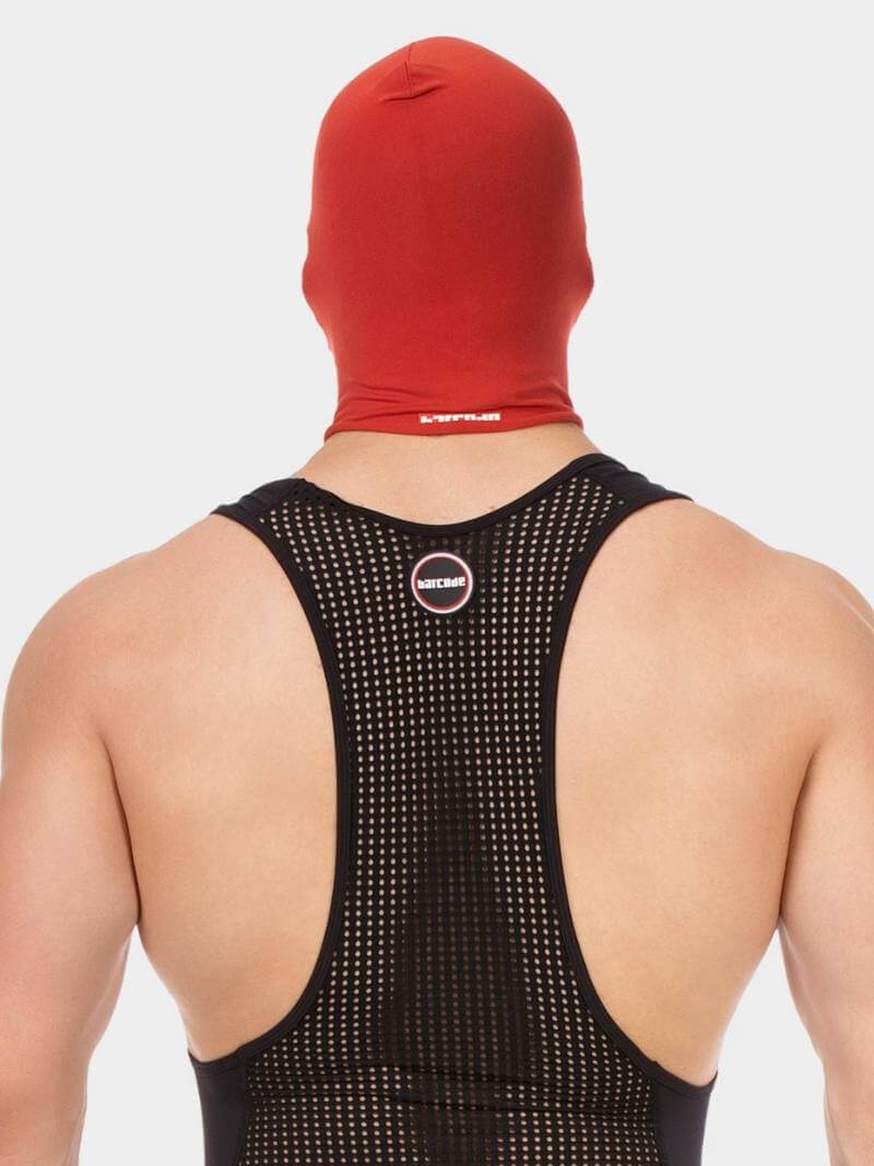 Person wearing a black athletic outfit with a red hood on a white background