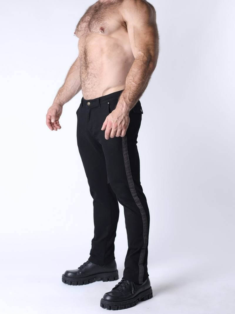 Man wearing black pants and black shoes on a white background