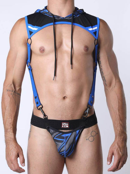 Man wearing a blue and black harness against a white background