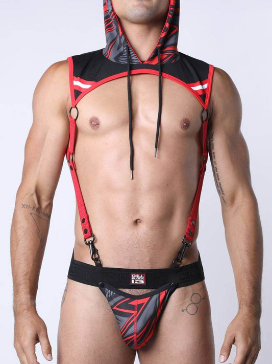 Man wearing a red and black harness with a plain background