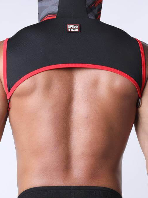 Person wearing a black and red athletic outfit on a plain background