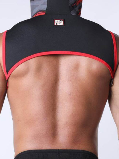 Person wearing a black and red athletic outfit on a plain background