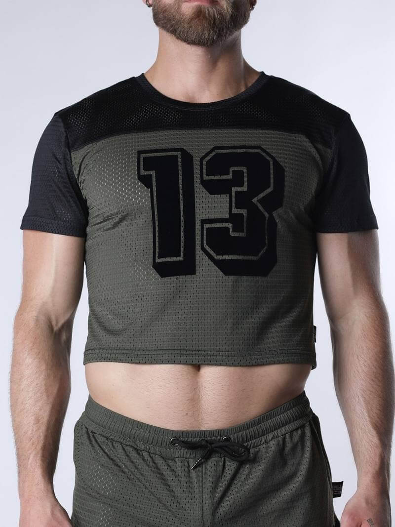 Person wearing a black and gray athletic outfit with the number 13 on a white background