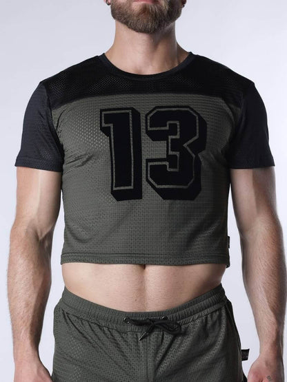 Person wearing a black and gray athletic outfit with the number 13 on a white background