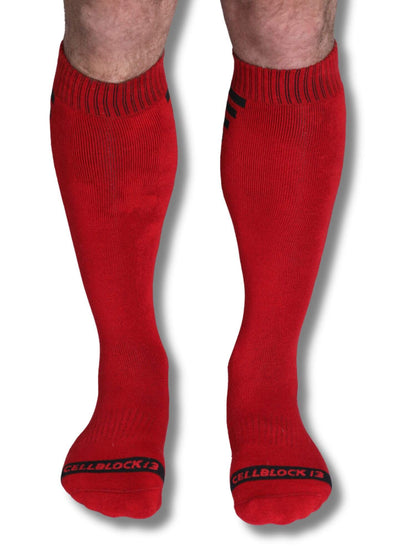 Red knee-high socks with a brand logo on a white background