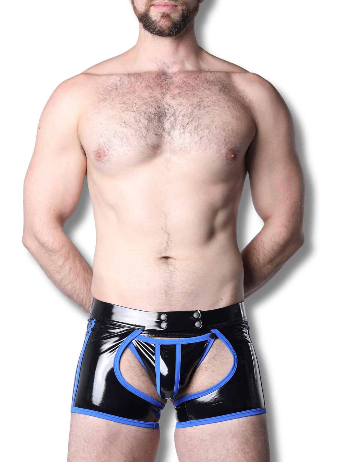 Man wearing black latex underwear with blue accents on a white background