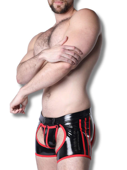Man wearing black and red latex underwear on a white background