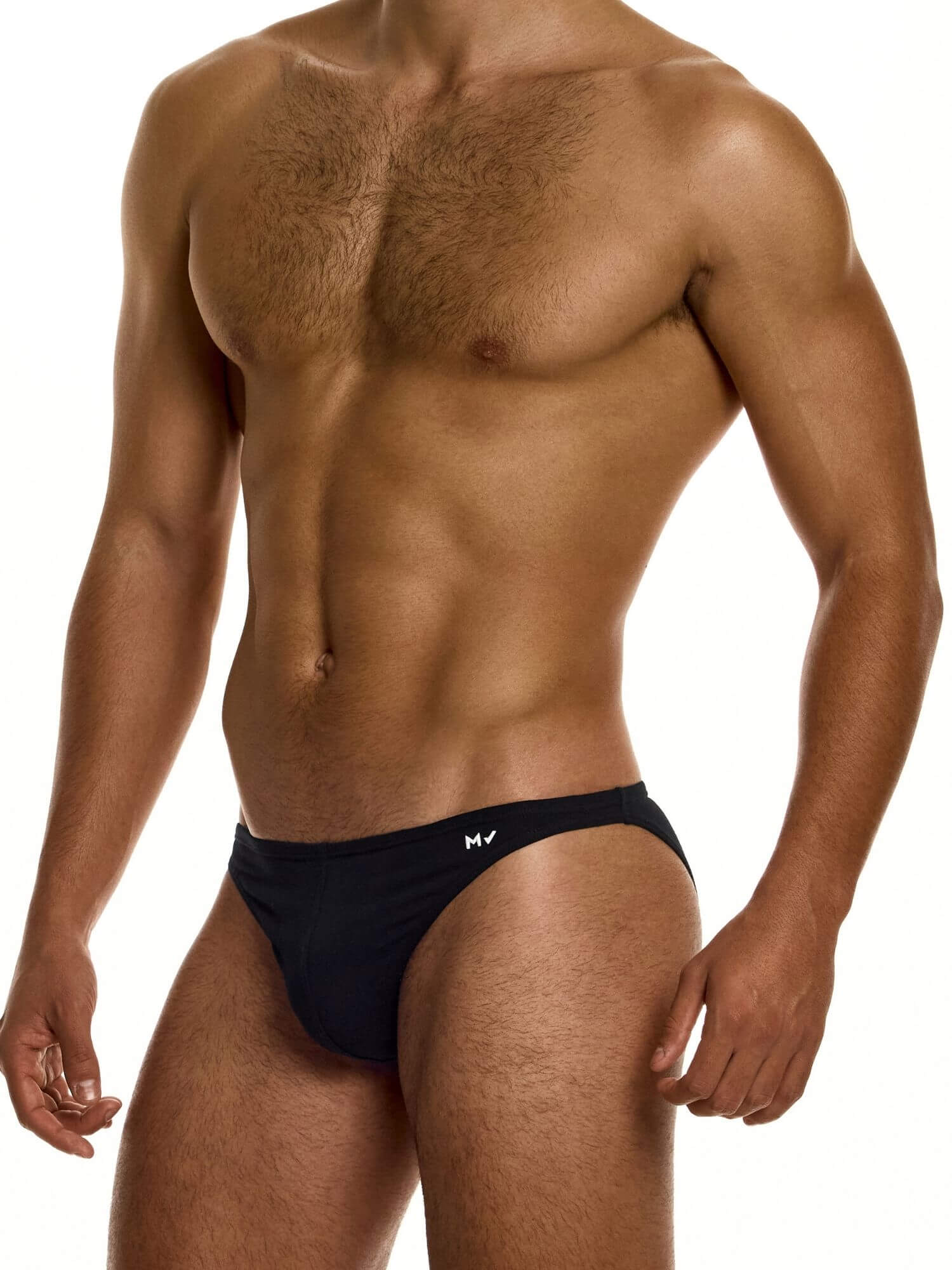 Man wearing black low cut briefs on a white background