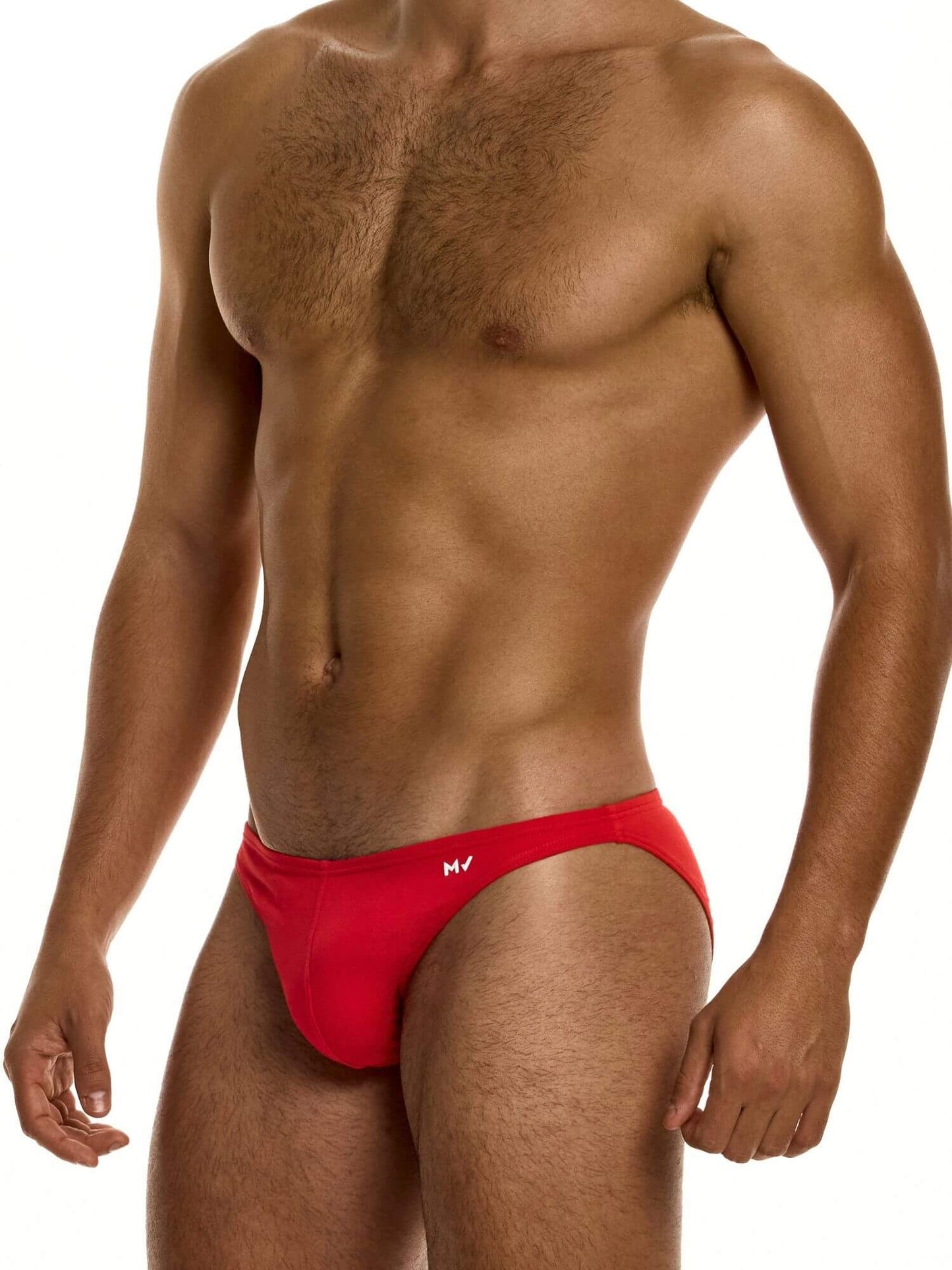 Man wearing a red low cut brief on a white background