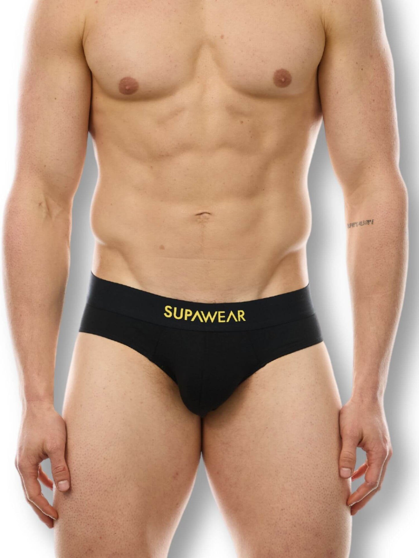 Man wearing a black men's underwear with 'Supawear' branding on a white background