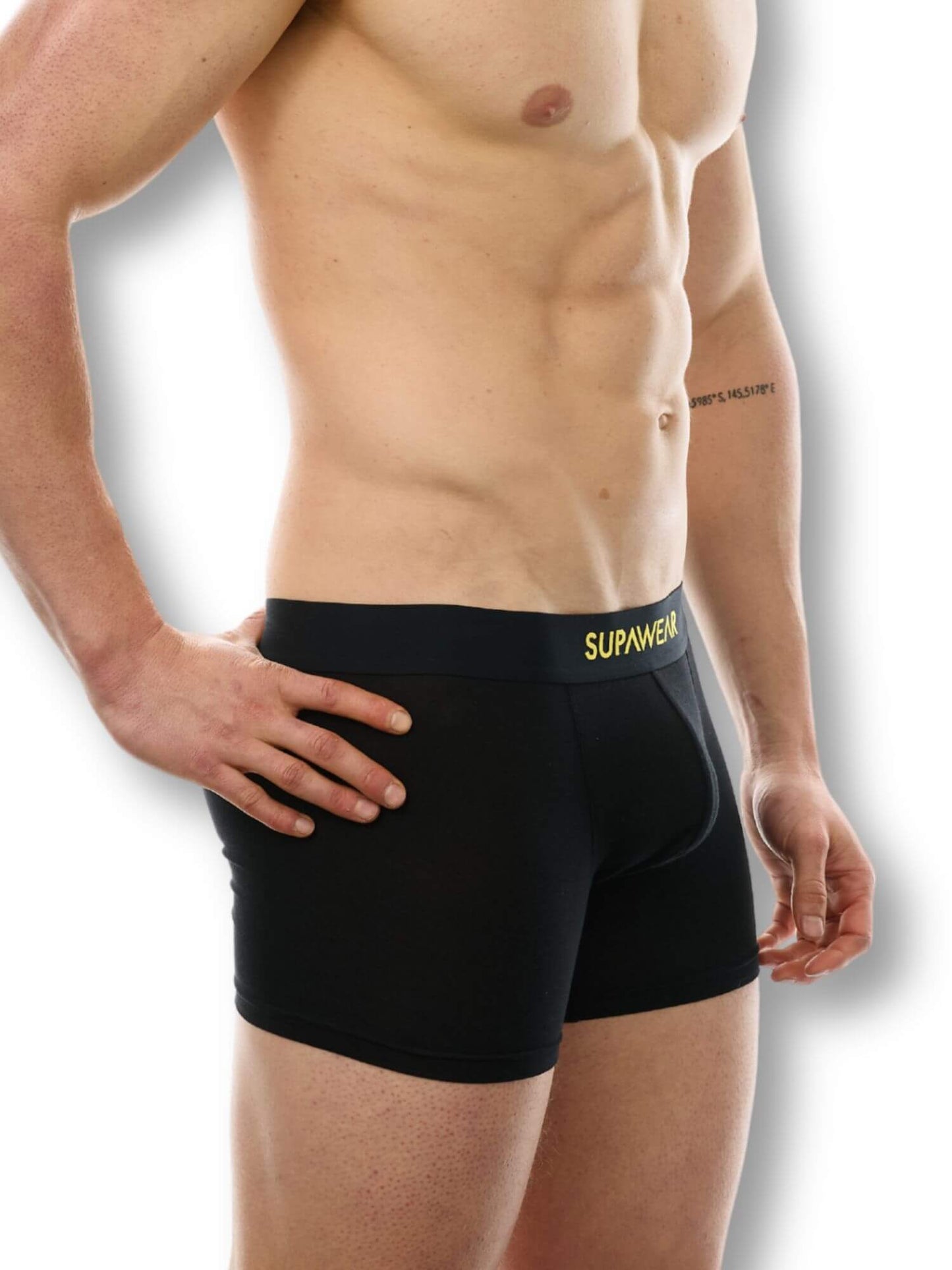 Black boxer briefs with yellow branding on a white background