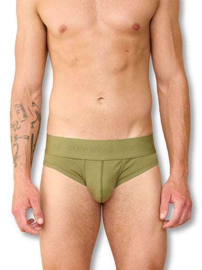 Man wearing a green underwear with 'Supawear' branding on a white background