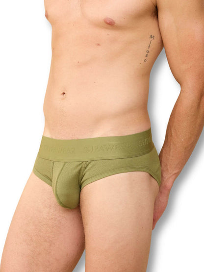 Green men's underwear worn by a person on a white background