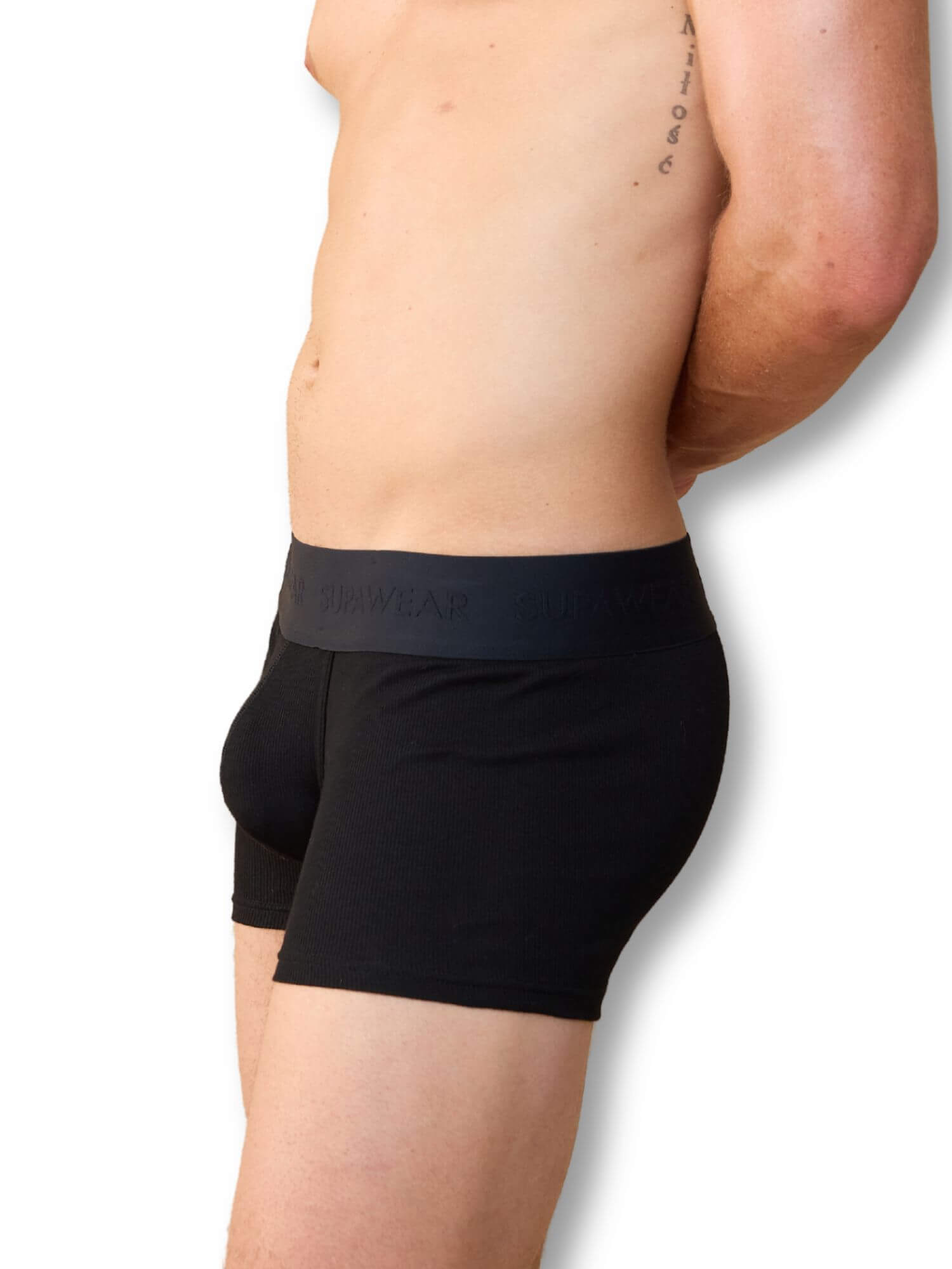 Person wearing black underwear with a visible brand logo on a white background